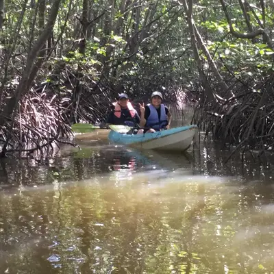 two people in a canoe in the water at Activities Resort in Ko Yao Yai