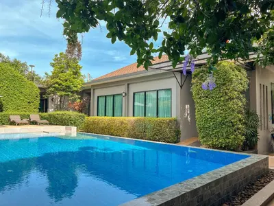 a swimming pool in front of a house at BaanMee Phuket near Chalong Pier in Chalong