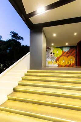 a set of stairs with a mural on the wall at Wake Up Aonang Hotel in Ao Nang Beach