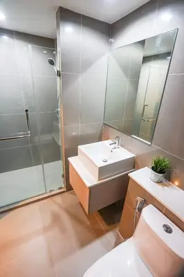 a bathroom with a sink and a shower and a toilet at Centrio nearby Central Phuket in Phuket Town