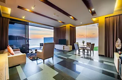 a living room with a view of the ocean at Impiana Private Villas Kata Noi in Kata Beach