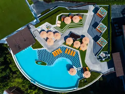 an aerial view of a resort with a swimming pool at The SIS Kata Resort - Adult Only in Kata Beach