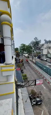 a balcony of a building with a view of a street at Cafe de Paris in Patong Beach