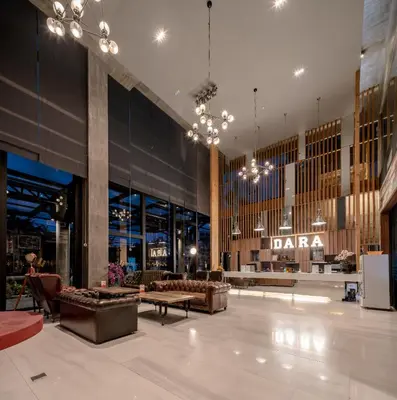 a large lobby with couches and a daria store at DARA Hotel in Phuket Town