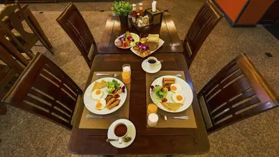 an overhead view of a table with eggs and food at Aonang Orchid Resort in Ao Nang Beach