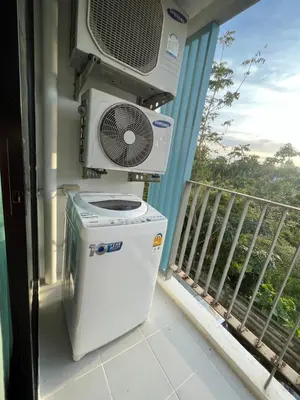 a air conditioner and a fan on a balcony at 1 bedroom Centrio Condominium Phuket Near Central Festival in Phuket town in Phuket Town