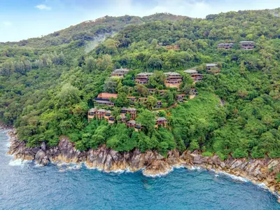 an aerial view of a resort on an island at Paresa Resort Phuket in Kamala Beach
