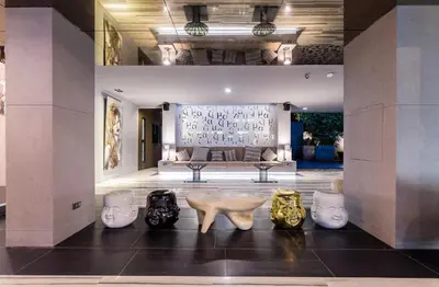 a room with a bunch of vases on the floor at Mazi Design Hotel by Kalima in Patong Beach