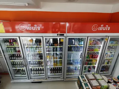 a soda machine in a store with drinks at Capricorn Village - SHA Extra Plus in Patong Beach