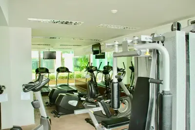 a gym with a row of exercise bikes in it at Art Patong by Moloko in Patong Beach
