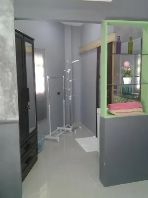 a bathroom with a walk in shower and a mirror at The Endless Bangtao Residence CAC 4 in Bang Tao Beach