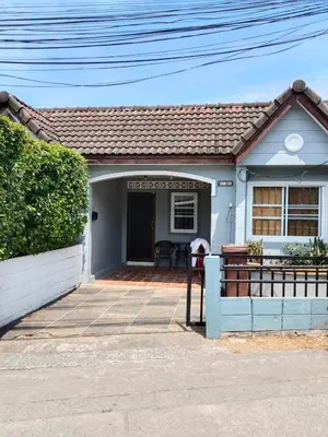 a small white house with a porch at The Endless Bangtao Residence CAC 2 in Bang Tao Beach