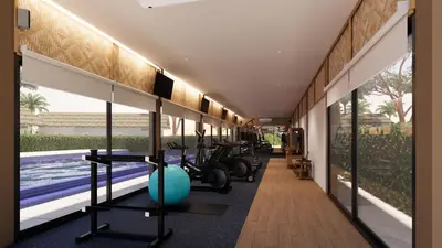 a gym with exercise equipment and a swimming pool at OUTRIGGER Phi Phi Island Resort in Phi Phi Don