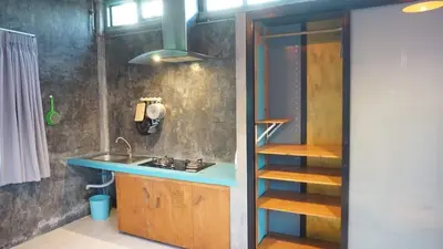 a small kitchen with a sink and a shelf at The Endless Bangtao Residence CHAT 2 in Bang Tao Beach