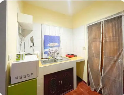 a small kitchen with a sink and a microwave at The Endless Bangtao Residence VC 1 in Bang Tao Beach