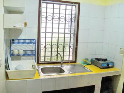 a small kitchen with a sink and a window at The Endless Bangtao Residence VC 1 in Bang Tao Beach