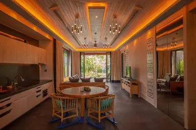 a kitchen with a table and chairs in a room at Baba Beach Club Phuket Natai Luxury Pool Villa Hotel by Sri panwa in Natai Beach