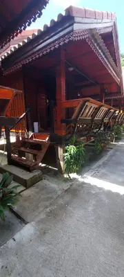 a building with a bunch of wooden beams on it at Phi Phi Sand Sea View Resort in Phi Phi Don