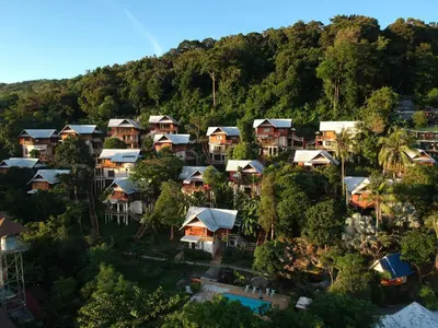 an aerial view of houses in a mountain at Phitharom PP Resort in Phi Phi Don