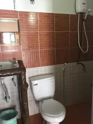 a bathroom with a toilet and a sink at Scenery Guest House in Phi Phi Don
