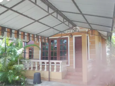 awning over a porch of a house at The Endless Bangtao Residence VC 2 in Bang Tao Beach