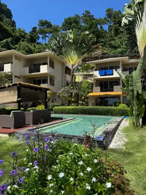 a resort with a swimming pool and a building at Mama Beach Residence - Adults Only in Phi Phi Don