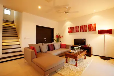a living room with a couch and a table at Two Villas HOLIDAY - Oxygen Style Bangtao Beach, Phuket in Bang Tao Beach