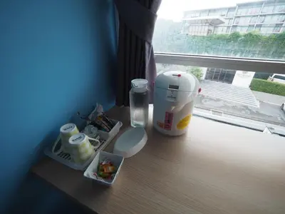 a table with a blender and a container of food at Sleepwell@naiyang in Nai Yang Beach