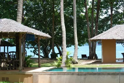 a resort with a swimming pool and a beach at KhaoTong Villa at Melina's in Tha Lane Bay
