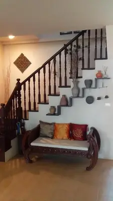 a bench in a room with a staircase at KhaoTong Villa at Melina's in Tha Lane Bay