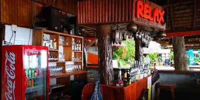 a bar with a coke machine in a room at Phi Phi Relax Beach Resort in Phi Phi Don