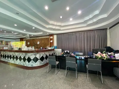 a lobby with a bar with chairs and a counter at Phi Phi Andaman Beach Resort in Phi Phi Don