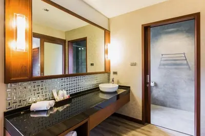 a bathroom with a sink and a mirror at Villa Raeya in Ao Nang Beach