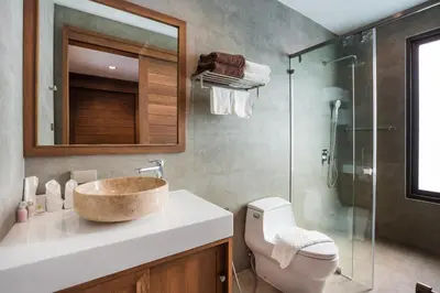a bathroom with a sink and a glass shower at Villa Palavee (B3) in Ao Nang Beach