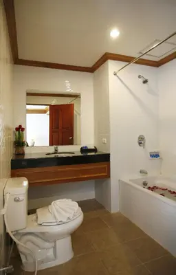 a bathroom with a toilet and a sink and a tub at Jiraporn Hill Resort in Patong Beach