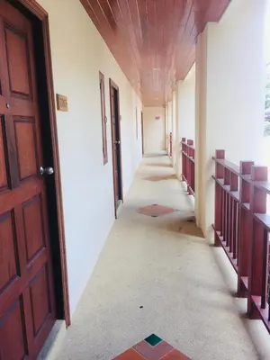 an empty hallway of a building with a door at Jiraporn Hill Resort in Patong Beach