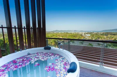 a bath tub filled with lots of colorful confetti at Chalong Chalet Resort in Chalong