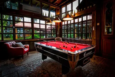 a billiard room with a red pool table in it at Naiyang Park Resort - SHA Extra Plus in Nai Yang Beach