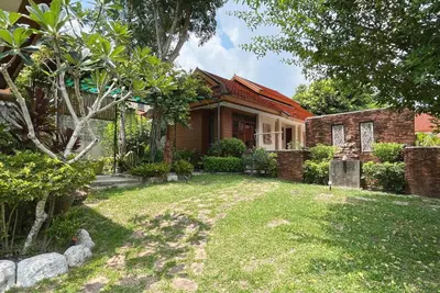 a house with a yard in front of it at Baleeyan in Thalang