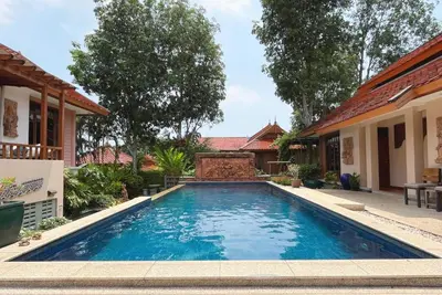 a swimming pool in the backyard of a house at Baleeyan in Thalang