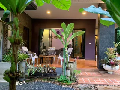 a living room with a bunch of plants at Smile Home Krabi Klong Moung Beach in Klong Muang Beach