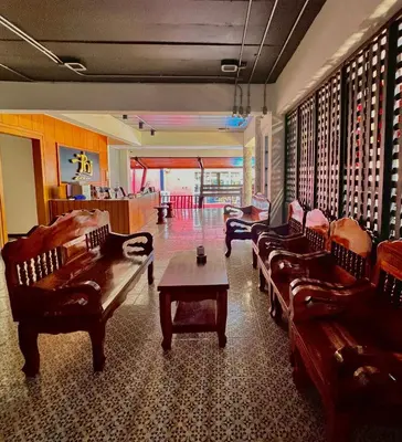 a living room with couches and a coffee table at Phi Phi Inn in Phi Phi Don