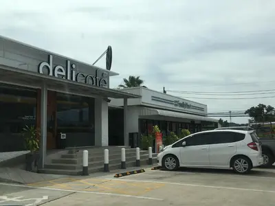 a white van parked in front of a store at D-condo mine in Kathu