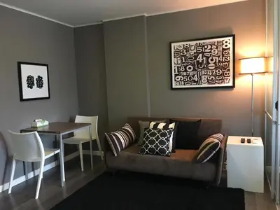 a living room with a couch and a table at D-condo mine in Kathu