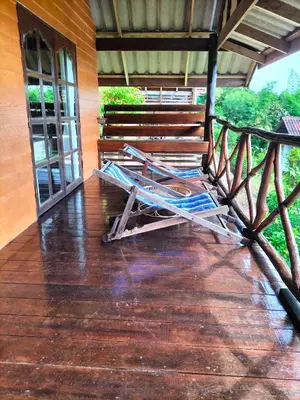two lawn chairs sitting on a wooden deck at Tabeak View Point in Ko Yao Noi