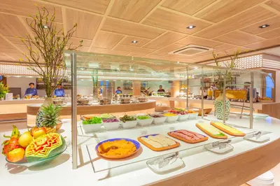 a buffet line with different types of food on display at Diamond Cliff Resort & Spa, Patong Beach in Patong Beach