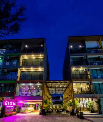 two buildings at night with the lights on at GLOW Ao Nang Krabi in Ao Nang Beach