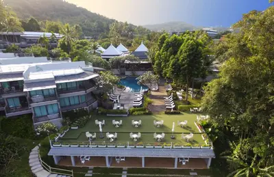 an aerial view of a resort with a garden at Andaman Cannacia Resort & Spa - SHA Extra Plus in Kata Beach