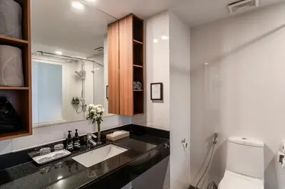 a bathroom with a sink and a toilet at Sunprime Kamala Beach in Kamala Beach