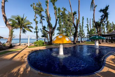 a fountain with a mushroom in the middle of the water at Sunwing Bangtao Beach in Bang Tao Beach